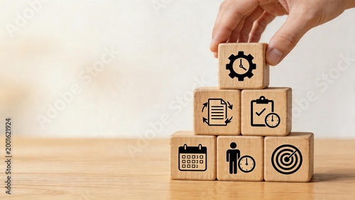Business man stacking wooden blocks with time management planning goal setting and productivity icons symbolizing corporate strategy execution process for office projects