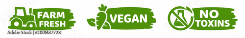 A set of three green grunge-style eco labels on white background: Farm Fresh with tractor, Vegan with carrot, and No Toxins with a crossed-out flask icon.