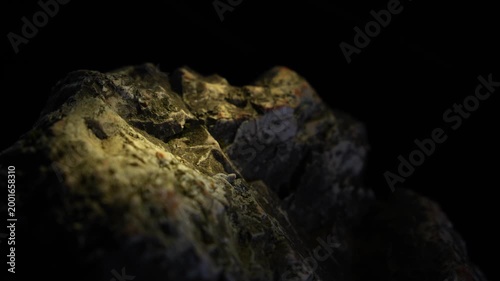 Narrow light streak across rocky surface with cinematic depth and texture