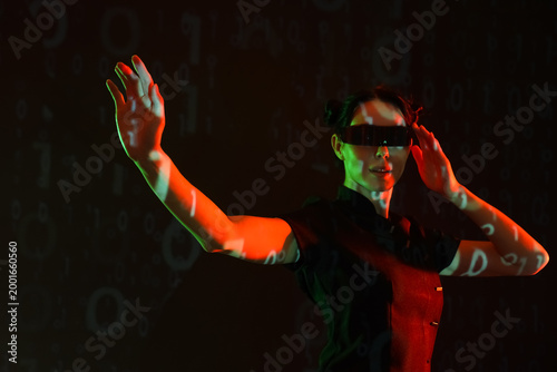 Young woman in VR glasses w...