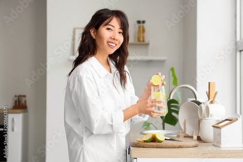 Young Asian woman with citr...