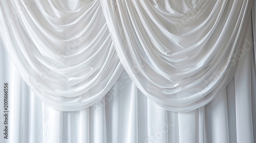 Elegant white draped fabric curtains with cascading swag folds forming a luxurious backdrop