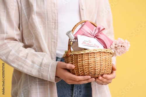 Young woman holding basket ...