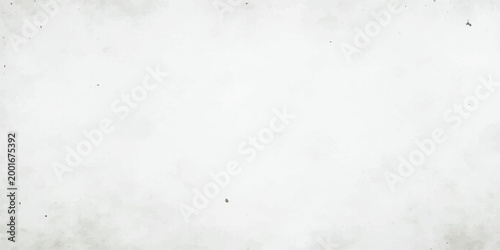 A vintage grunge paper texture features a rough grey surface with a dirty paint pattern and a blank stone material design for a textured old wall background