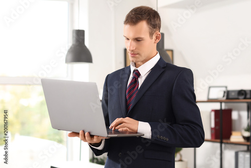 Handsome businessman workin...