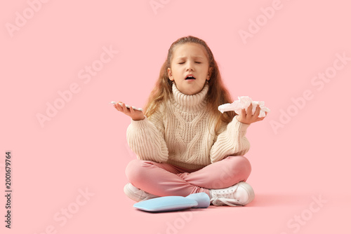 Sick little girl with pills...