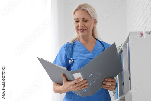 Mature female doctor with f...