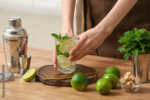 Young woman with glass of f...