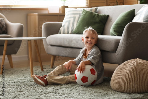 Cute little boy sitting on ...