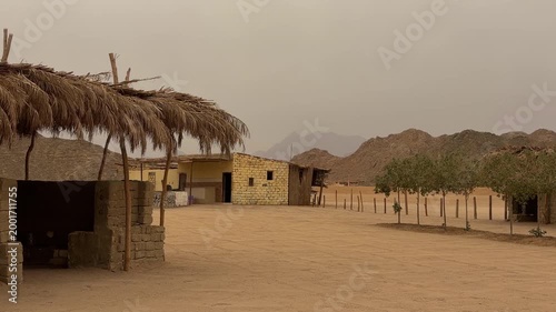 Serene Traditional Market Shelter Surrounded By Adobe Constructions And Tranquil Open Courtyard