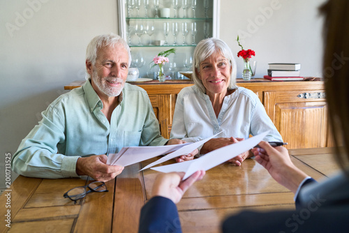 Принти на полотні Retirement Planning And Financial Protection: Senior Couple Receiving Profession