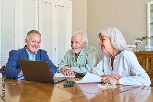 Bild auf Leinwand Retirement Planning And Financial Protection: Senior Couple Receiving Profession