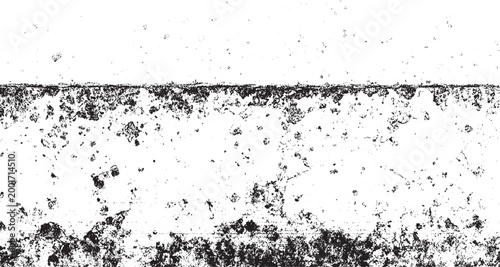 Black and white textured grunge background with scattered speckles and rough edges abstract