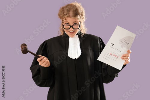 Female judge with gavel and...
