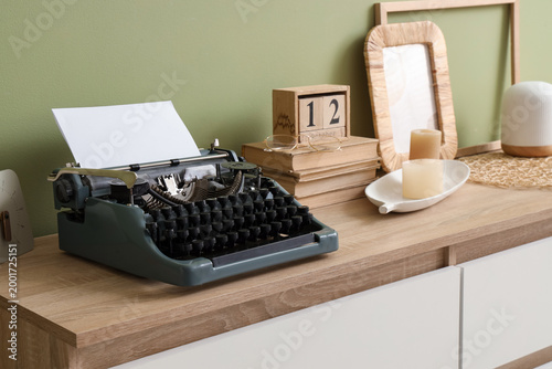 Vintage typewriter with boo...