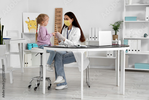 Female pediatrician with li...