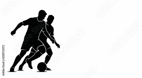 Silhouette of two soccer players dribbling a ball