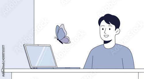 Man working on laptop, butterfly flying near, symbolizing inspiration and creativity