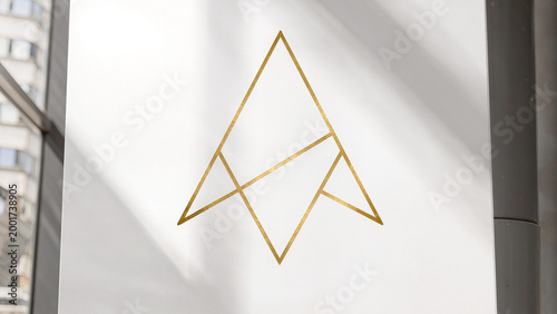 Golden geometric logo on white facade.
​Premium metallic branding for luxury identity.
​Minimalist triangle icon in gold foil.
​Elegant corporate signage with sharp lines.
​Sophisticated gold symbol 