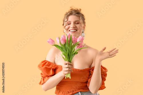 Happy young woman with bouq...