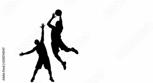 Silhouette of two basketball players jumping for a ball