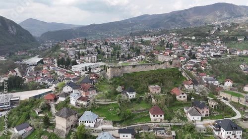 High-angle 4K drone shot of the historic Jajce Fortress and the old town citadel