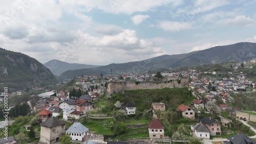 High-angle 4K drone shot of the historic Jajce Fortress and the old town citadel