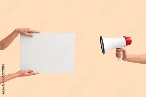 Female hands with megaphone...