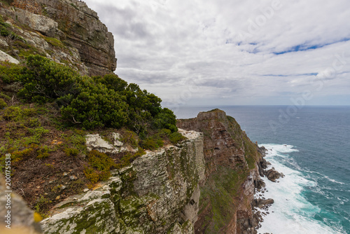 Cape Point is a promontory at the southeast corner of the Cape Peninsula, a mountainous and scenic landform with rugged rocks and sheer cliffs towering more than 200 metres above the sea and cutting d