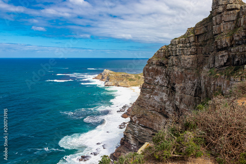 Cape Point is a promontory at the southeast corner of the Cape Peninsula, a mountainous and scenic landform with rugged rocks and sheer cliffs towering more than 200 metres above the sea and cutting d
