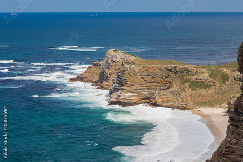 Cape Point is a promontory at the southeast corner of the Cape Peninsula, a mountainous and scenic landform with rugged rocks and sheer cliffs towering more than 200 metres above the sea and cutting d