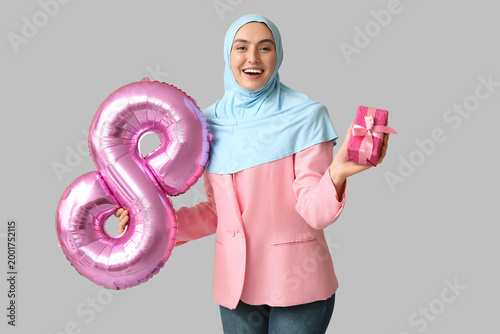 Happy young Muslim woman in...
