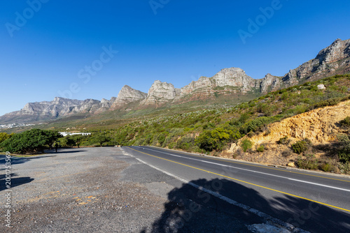 the Twelve Apostles seen from one of the most beautiful and scenic stretches of Victoria Road in Cape Town. it runs between Sea Point and Hout Bay. It is an incredible drive connecting Camps Bay, Clif