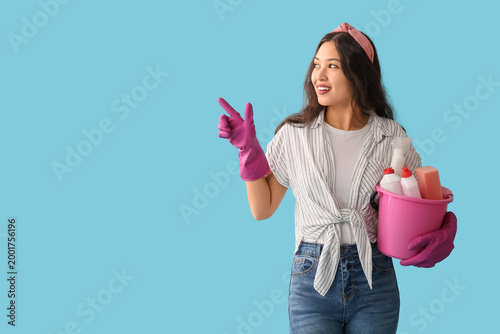 Young woman with bucket of ...