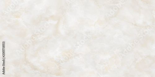 An abstract closeup of white flour and salt texture resembling cotton wool or sand creates a vintage grunge parchment effect on an aged beige stone wall
