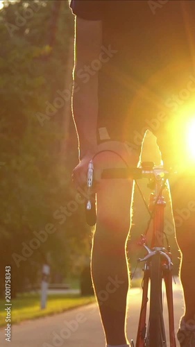 A cyclist trains before a competition. Or an active break after a sedentary day at work.