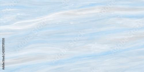 Beautiful summer nature cloudscape with white clouds in a clear blue sky over abstract blue water texture and calm sea under the bright sun light