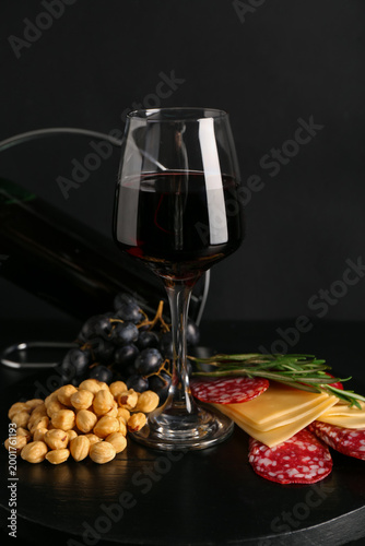 Glass of red wine with snac...