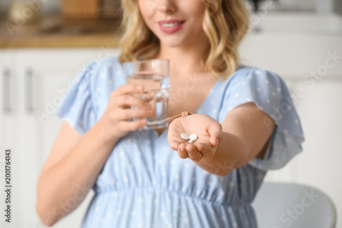Young woman with glass of w...