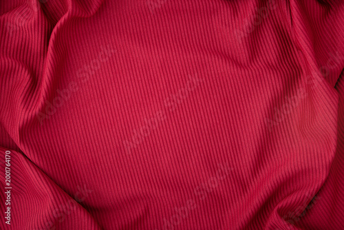 Elegant rich and vibrant red cot fabric texture background with soft folds