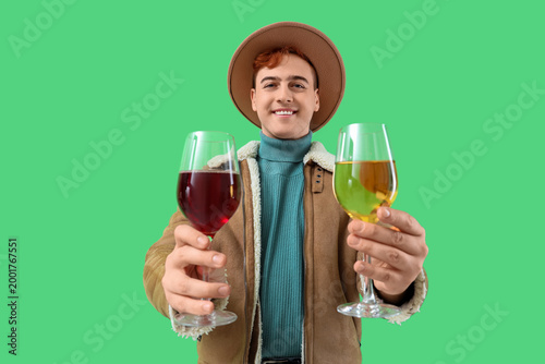 Young man with glasses of w...