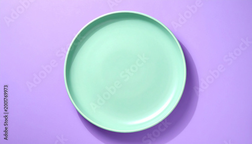 Empty Mint Green Plate on Purple Background