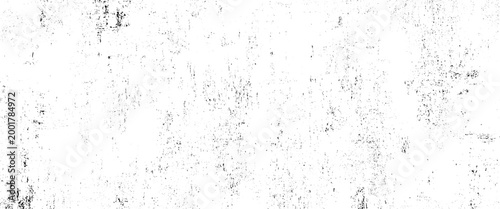 Black and white textured background with distressed grunge effect and scattered speckles