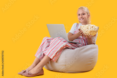 Happy girl with bucket of p...