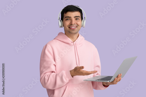 Male programmer in headphon...