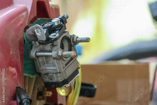 Принти на полотні Close up detail of metal carburetor on small engine showing complex mechanical p