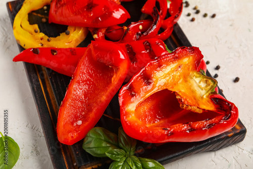 Wooden board with tasty gri...