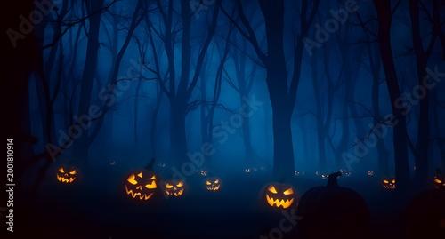Eerie Halloween pumpkins glowing in a forest covered with deep blue fog, creating a cinematic and mysterious atmosphere.