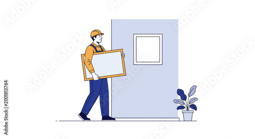 Professional worker in a hard hat and uniform carefully carries a large framed painting to hang it on a wall in a clean, modern room.