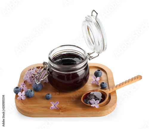 Board with jar of sweet blu...
